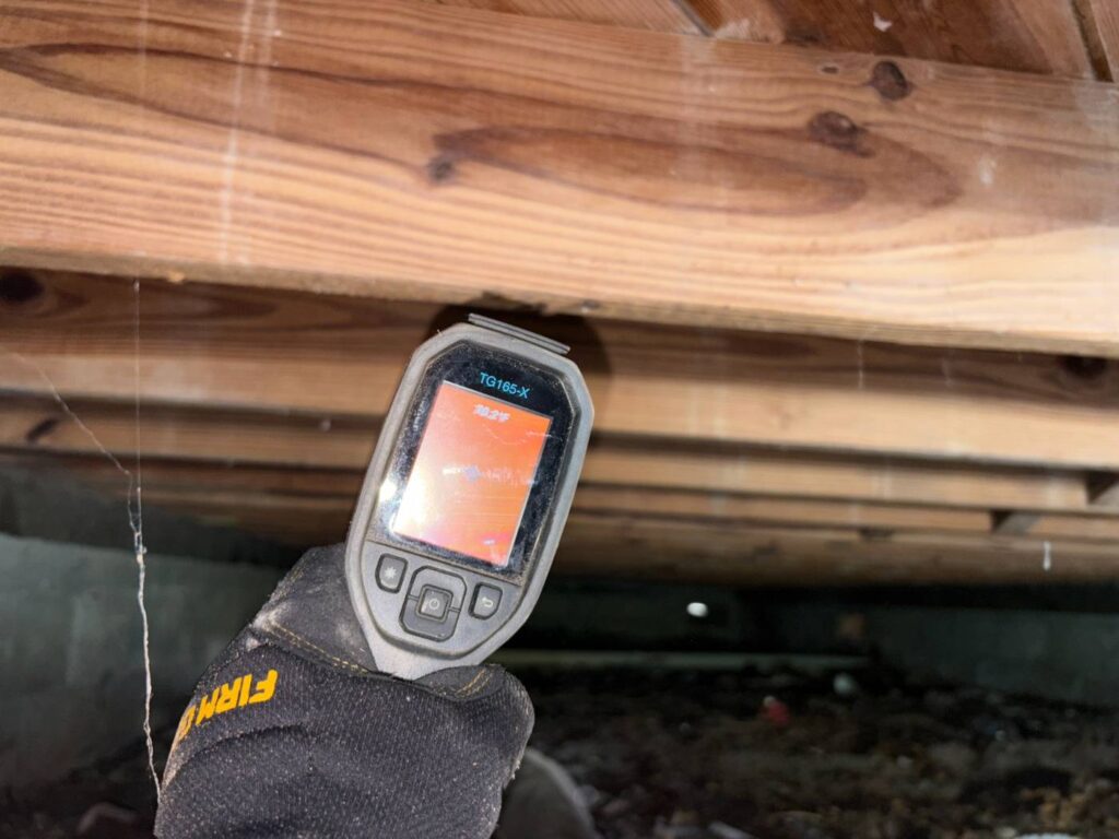 Home inspector documenting shower and plumbing fixtures during a Florida home inspection