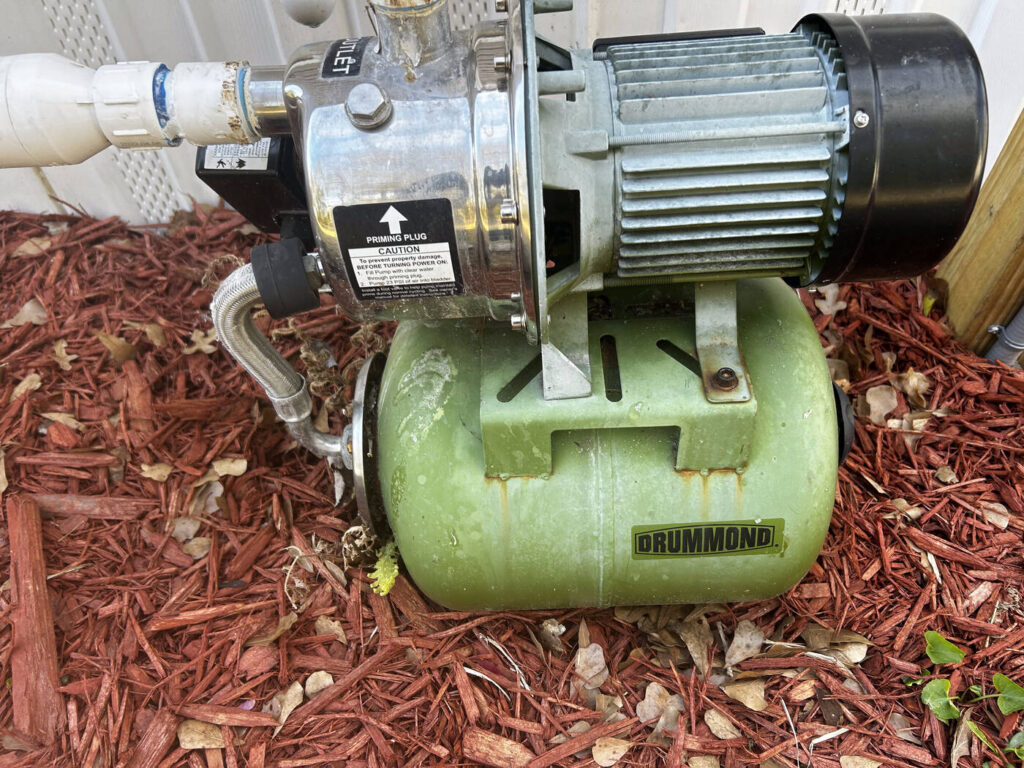 Well pump and pressure tank system inspected for PFAS in well water testing, Florida home