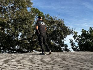 UAD 3.6 and home inspection: ALEX Home Inspection Services inspector evaluating a shingle roof in Florida